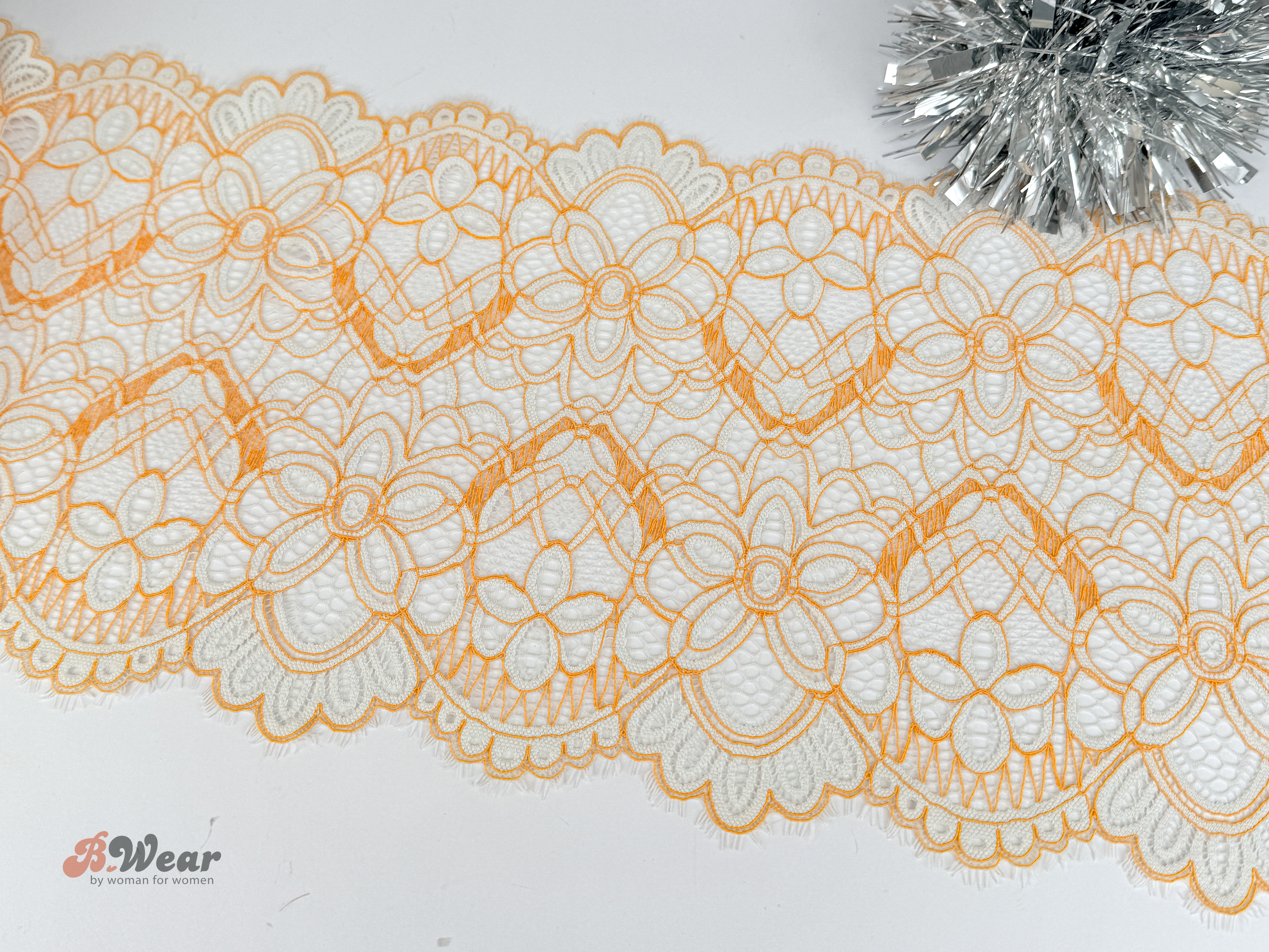 Lovely off-white stretch lace with orange pattern - 24 cm