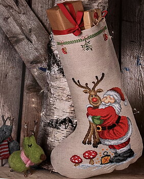 Julstrumpa. Tomten kramar Rudolf.