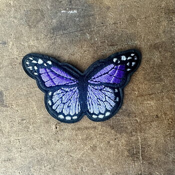 Tygmärke lila fjäril