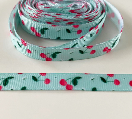 Printed cherrys on turquise 10mm