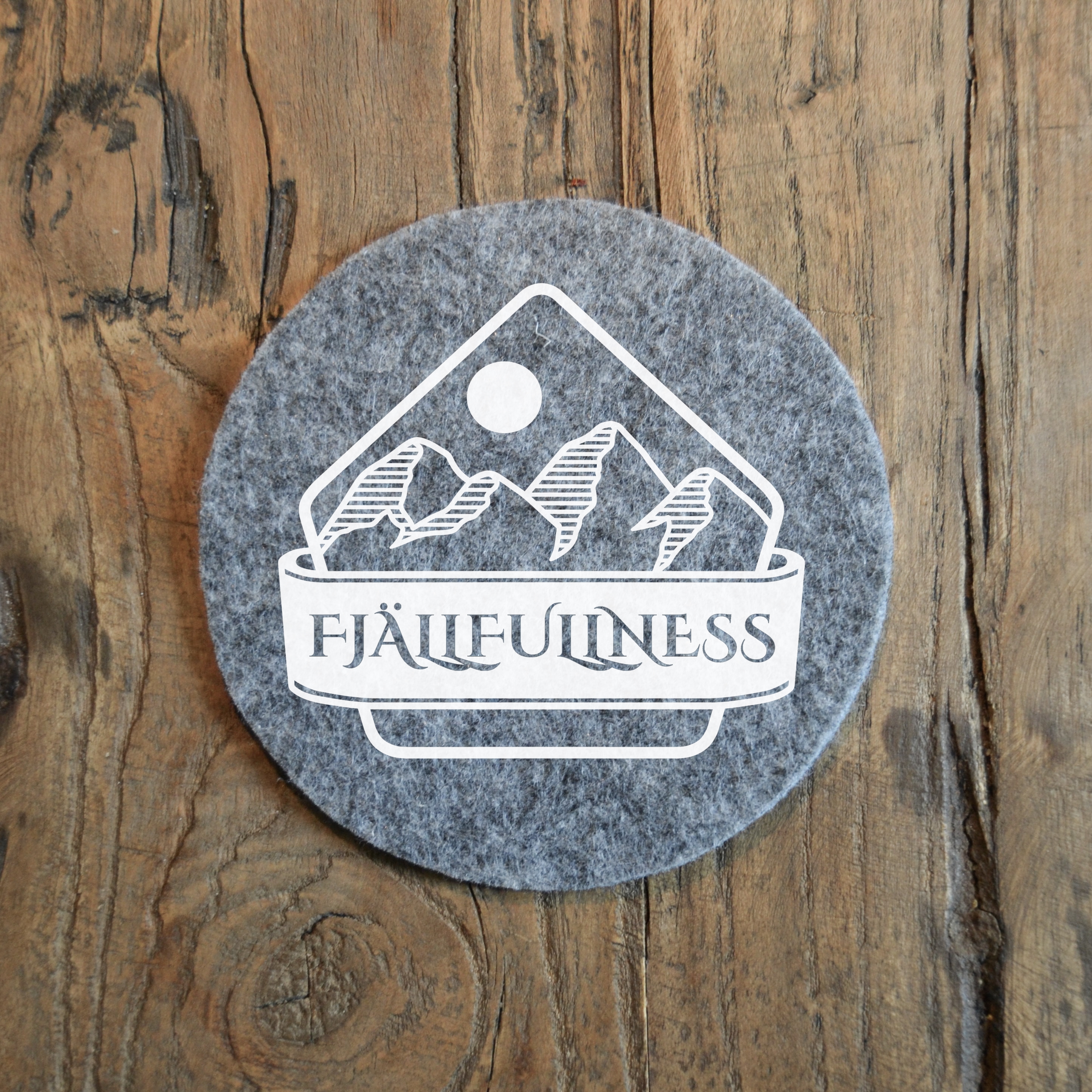 Glasunderlägg - "Fjällfullness" märke
