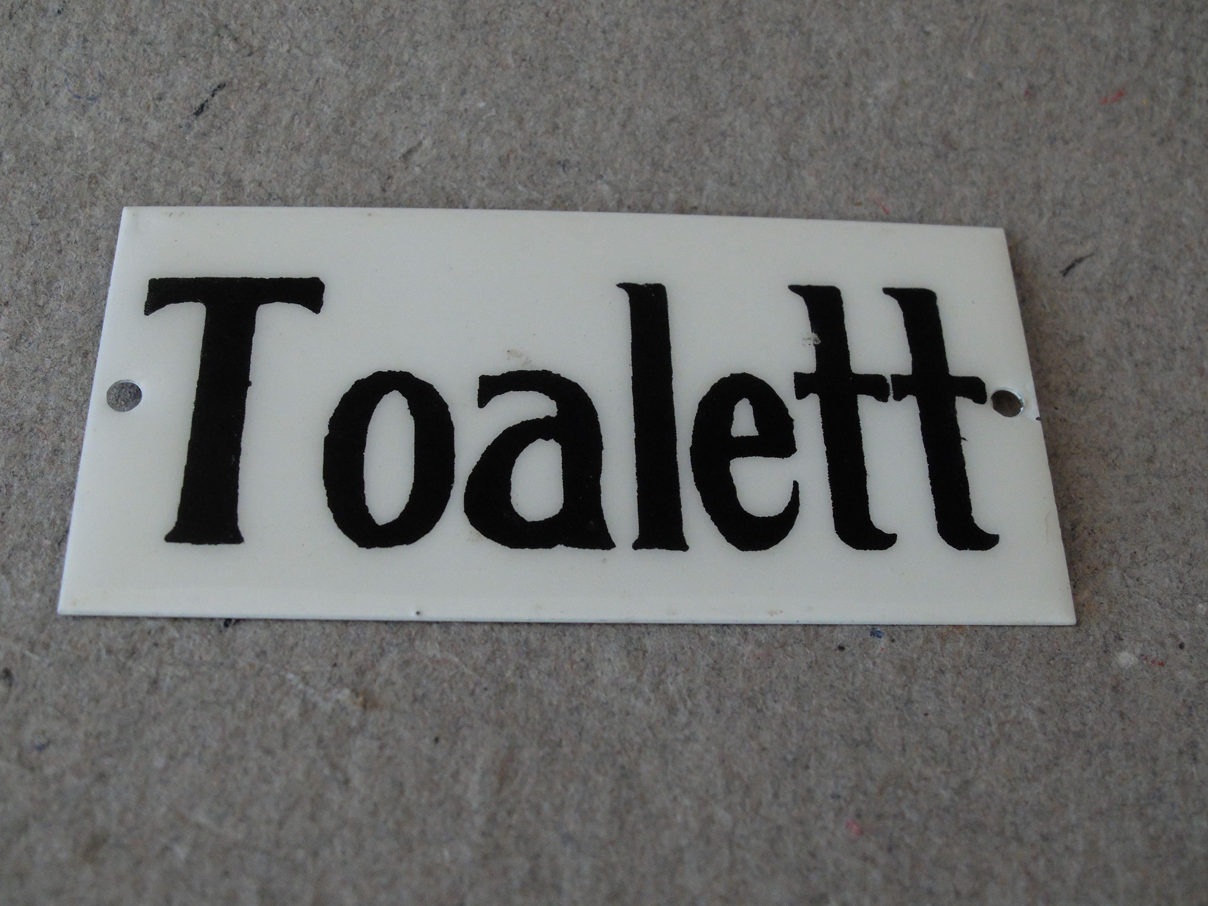 Skylt-Toalett