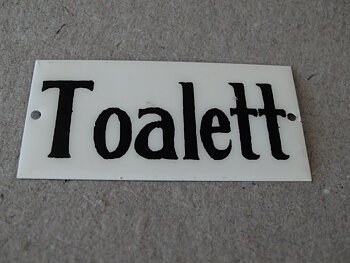 Skylt-Toalett