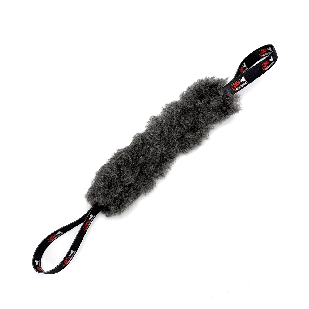 Jami Slitvette playing roll with fake fur dog toy from Sweden