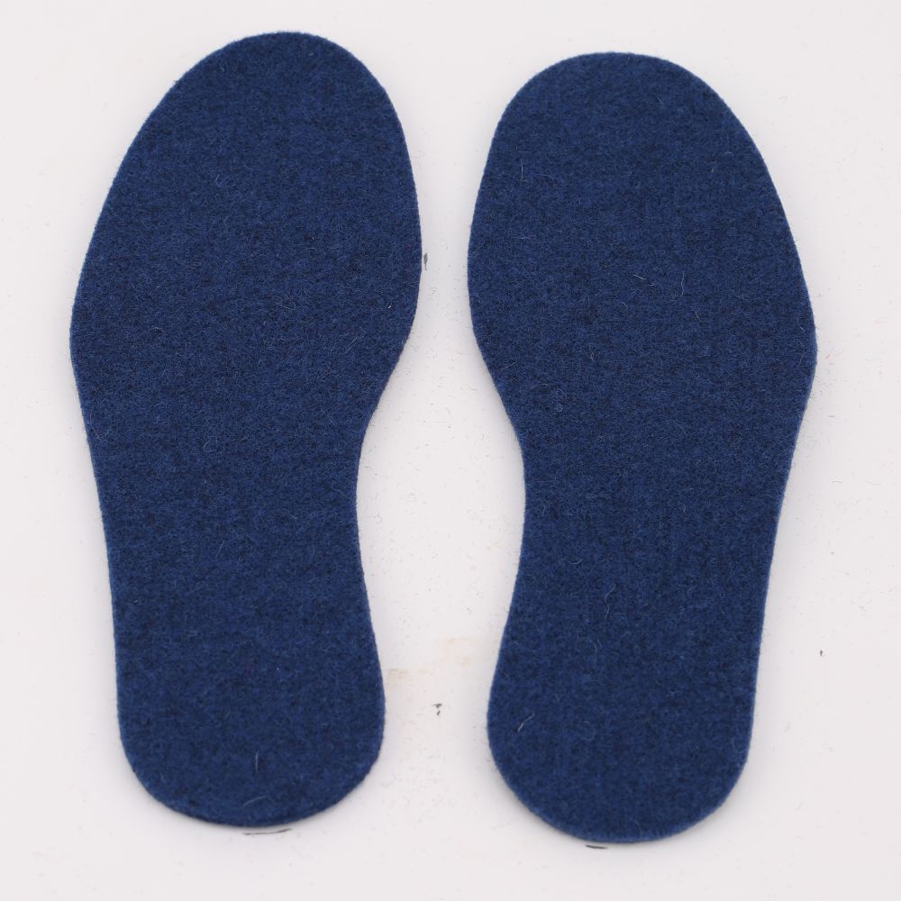 A pair of felted wool insoles in the color blue