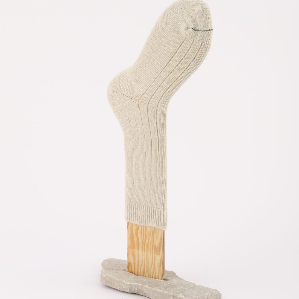 Tjock socka av mohair i naturvitt