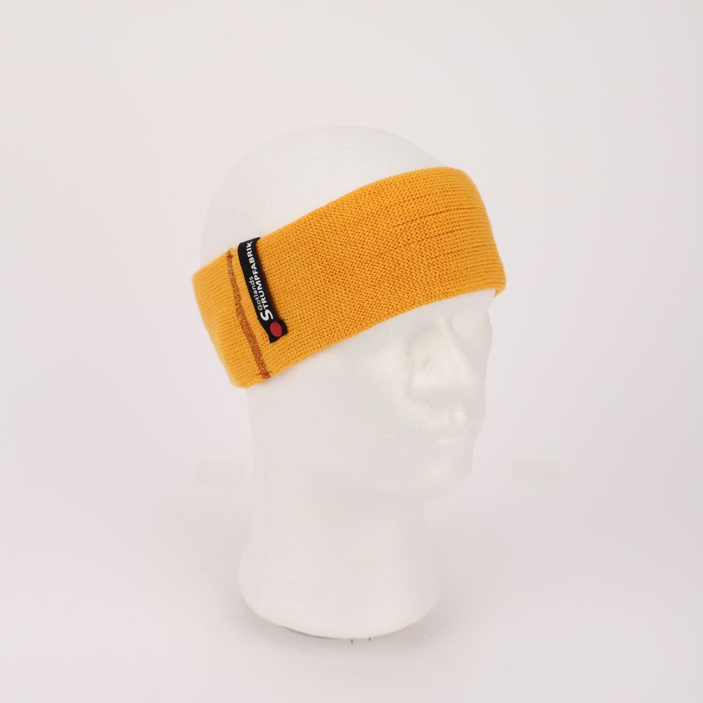 Stickat pannband av merinoull i färgen mango