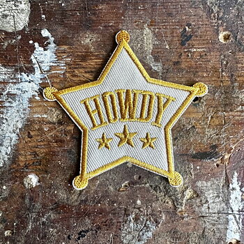 Tygmärke Howdy 