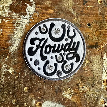 Tygmärke Howdy  