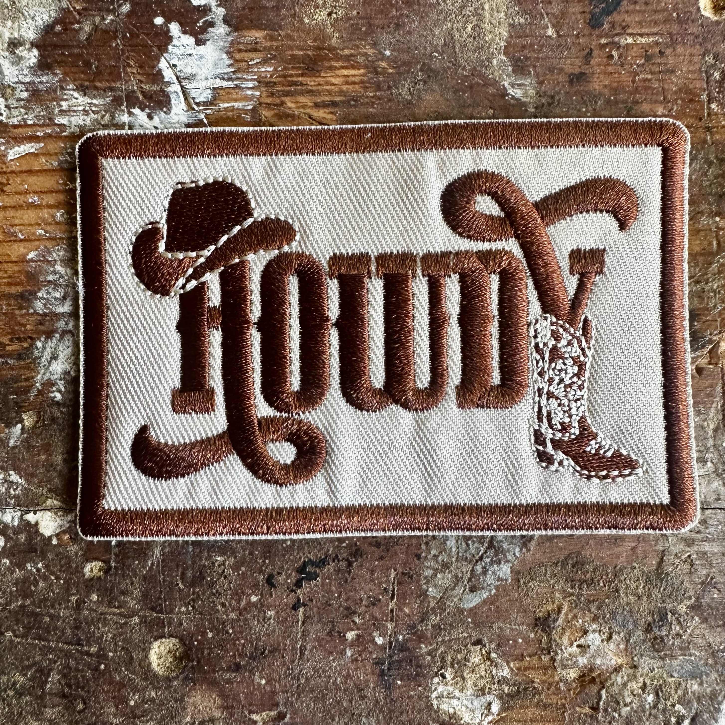 Tygmärke Howdy  