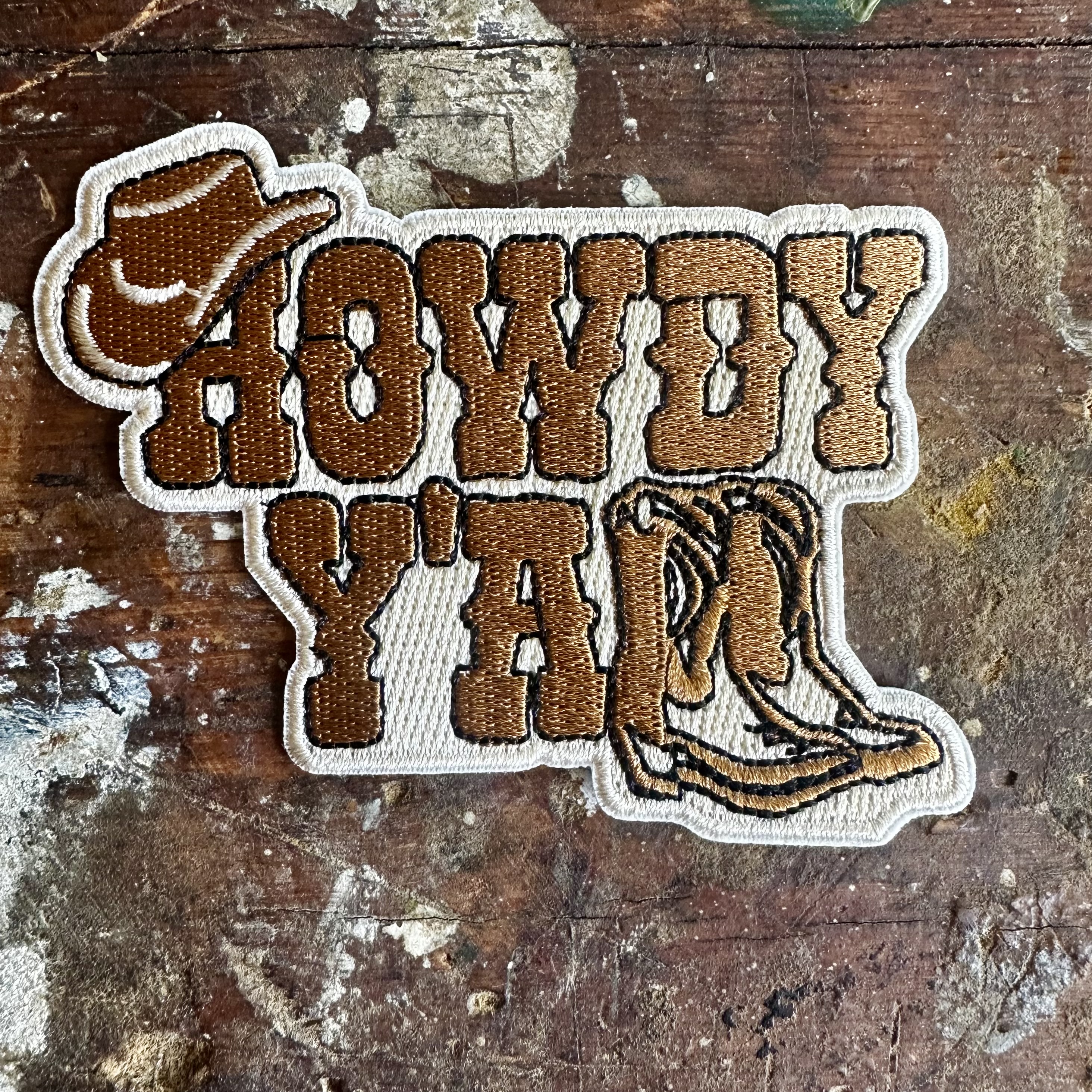 Tygmärke Howdy 