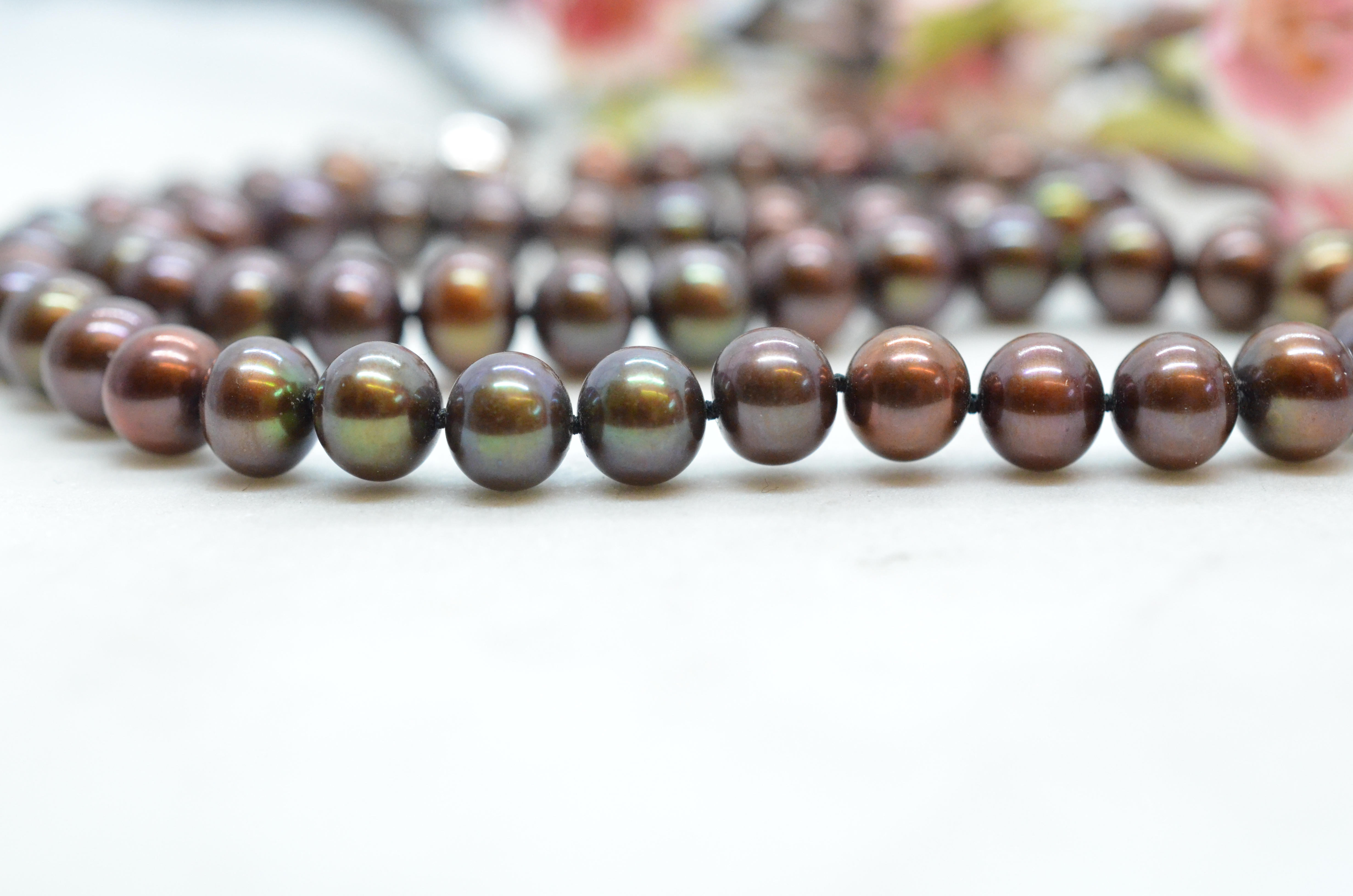 Pearl necklace with colored freshwater pearls in brown-green shade