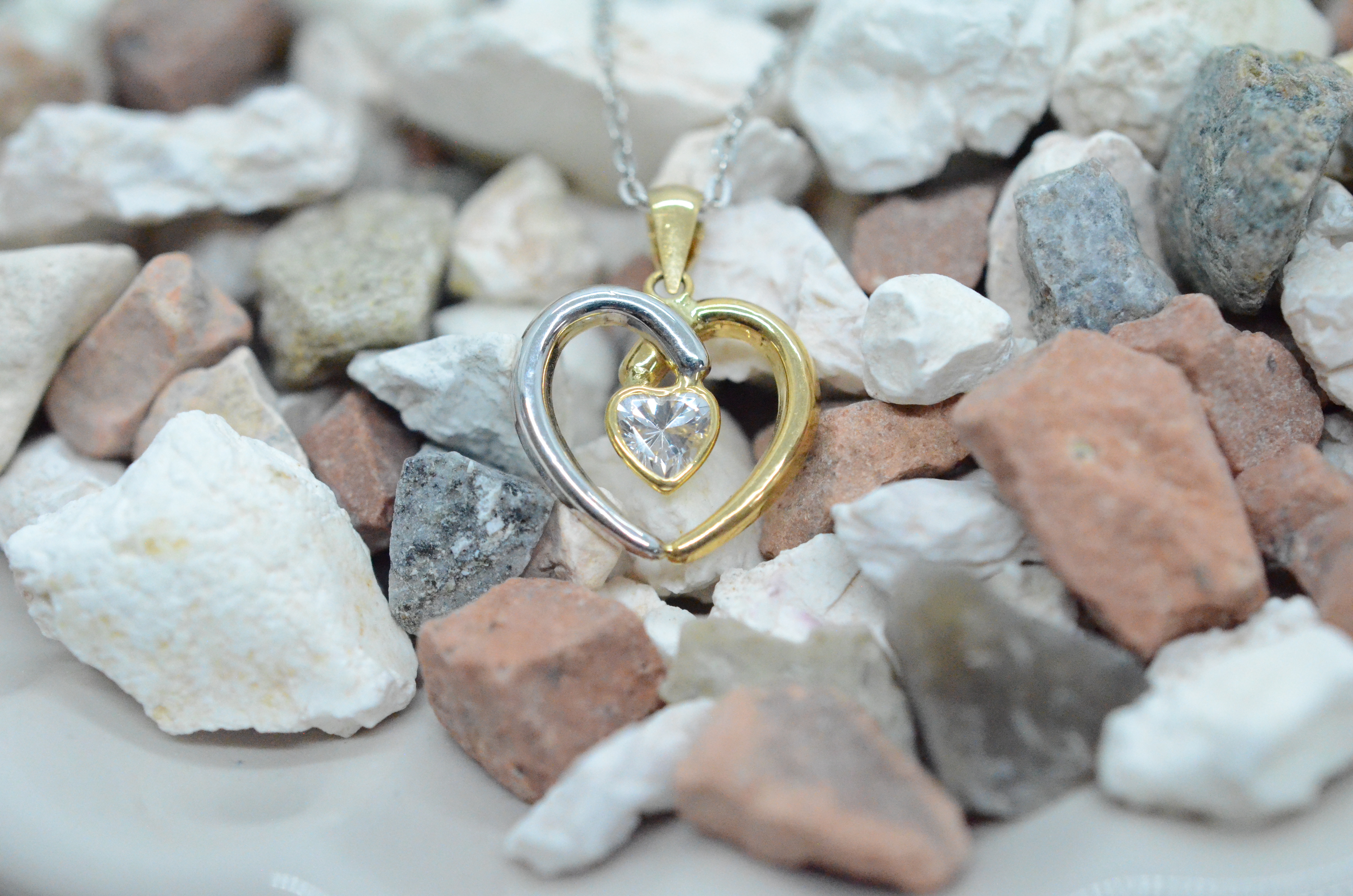 18k two color heart pendant with cz