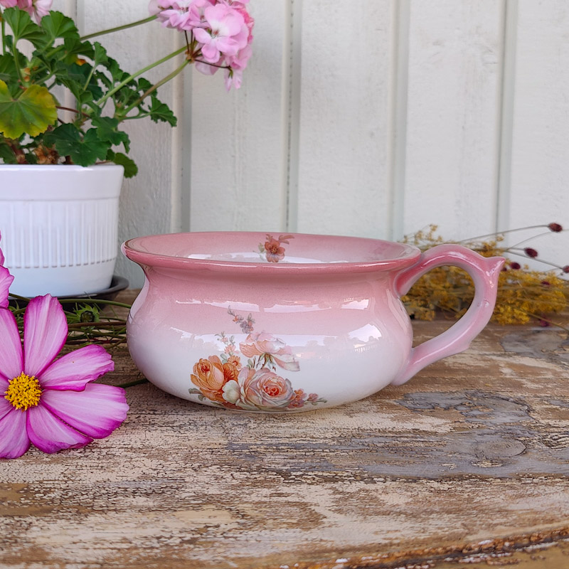 Potta med rosa blomdekor
