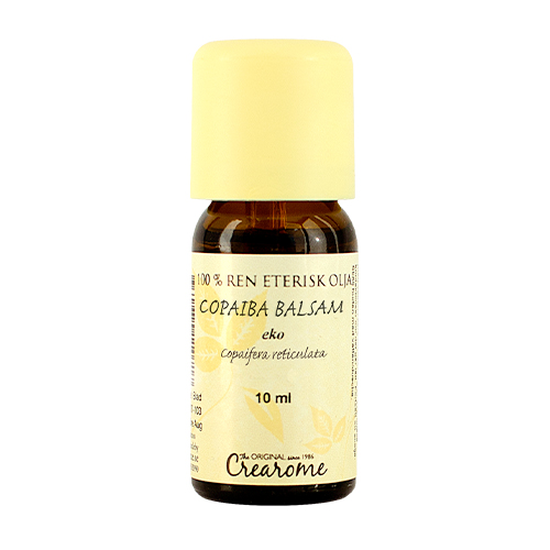 En liten brun glasflaska med gul etikett och gul plastkork. På etiketten står Copaiba Balsam Eko 10 ml.