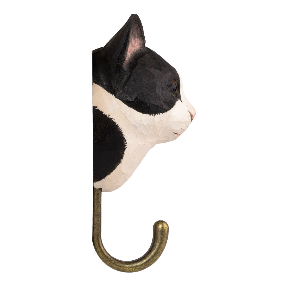 Schwarz-weißer Katzenhaken von der Seite gezeigt, mit klarer Farbaufteilung und messingfarbenem Metallhaken.