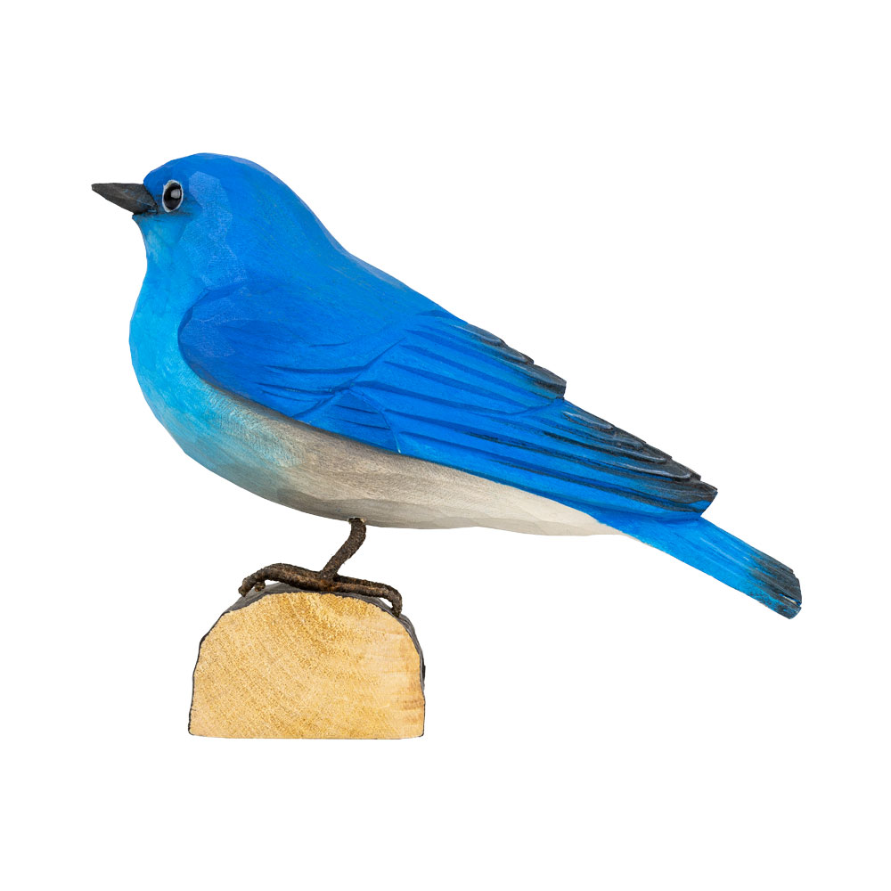 Left view of DecoBird Mountain Bluebird, with the bright blue bird in profile on its wooden base.