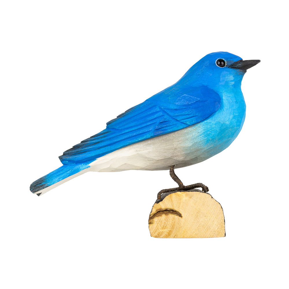 Right view of DecoBird Mountain Bluebird, showing the bright blue hand-carved bird on its wooden base.