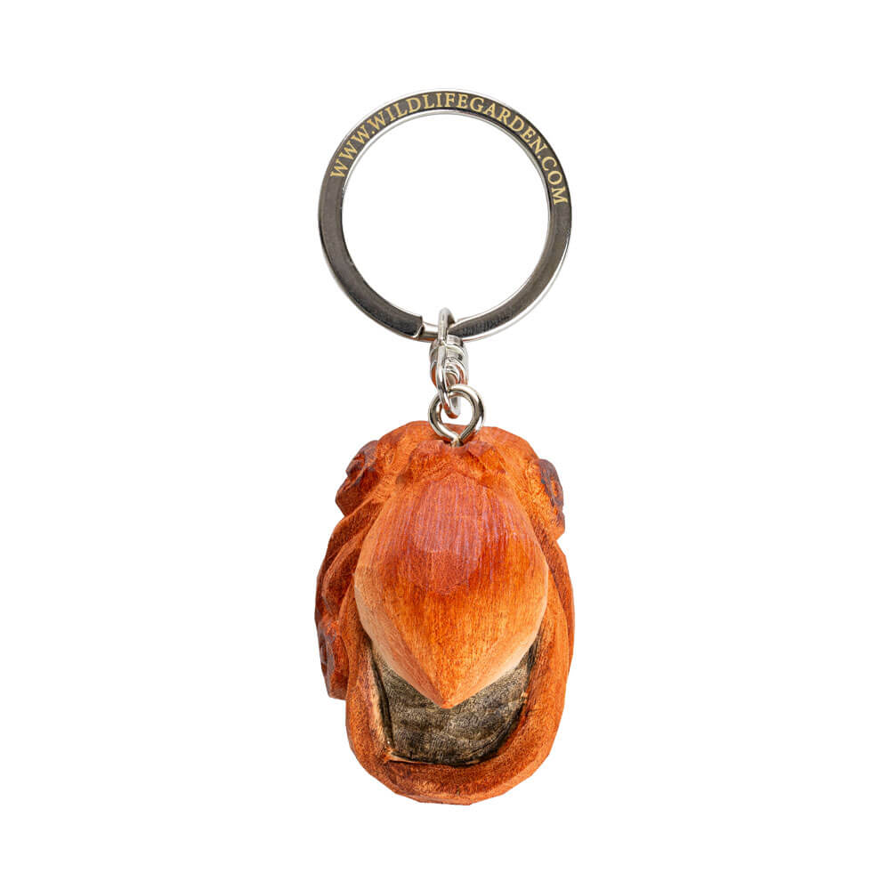 Porte-clés Poulpe vu de dessus avec une figurine de poulpe sculptée à la main sur fond blanc.
