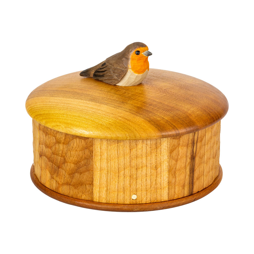 Wooden Box Robin seen from a high angle, showing the hand-carved robin and the rounded cherrywood lid.