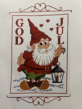 Julvepa. Glad tomte med lykta.