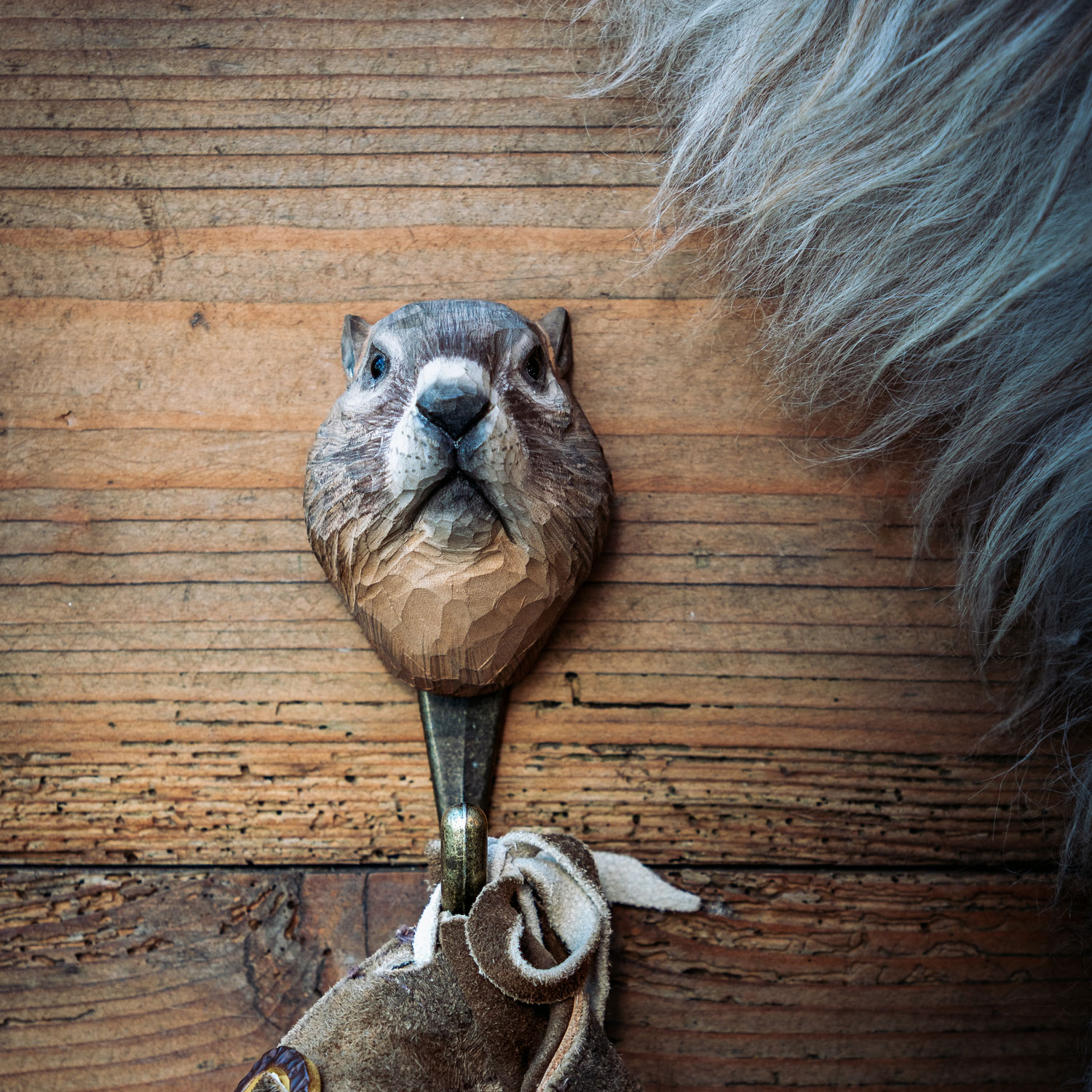 Hook with hand-carved marmot in gift box together with accompanying fact booklet.