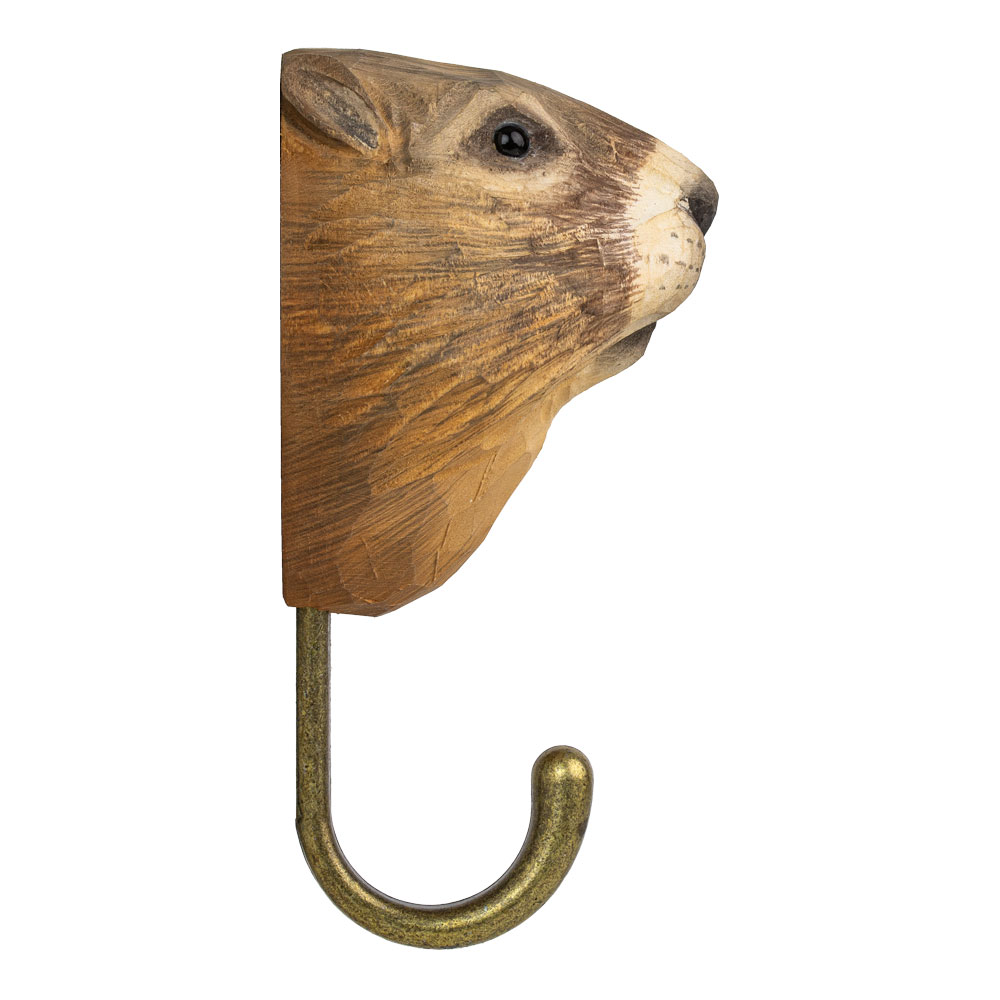 Hand-carved Hook Marmot in side view showing the rounded muzzle profile and carved fur texture.