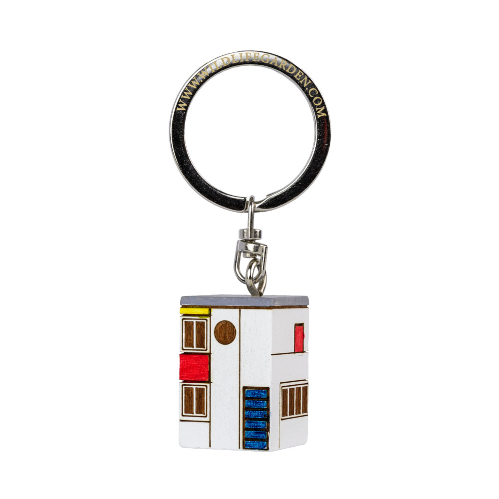 Porte-clés De Stijl vu de trois quarts sur fond clair.