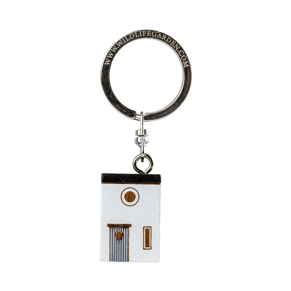 Porte-clés Maison Moderne vu de face sur fond clair.