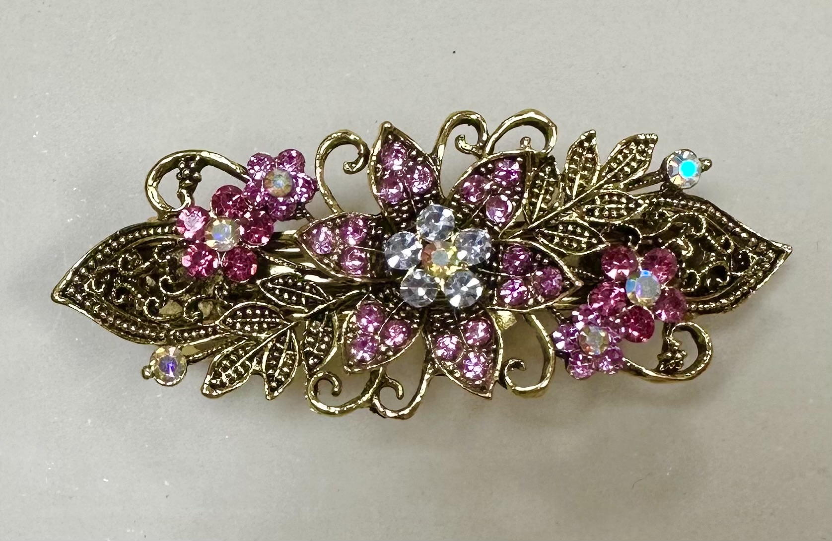 Mässingfärgad klämma med strass- rosa