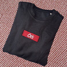 Svart sweatshirt med broderat märke