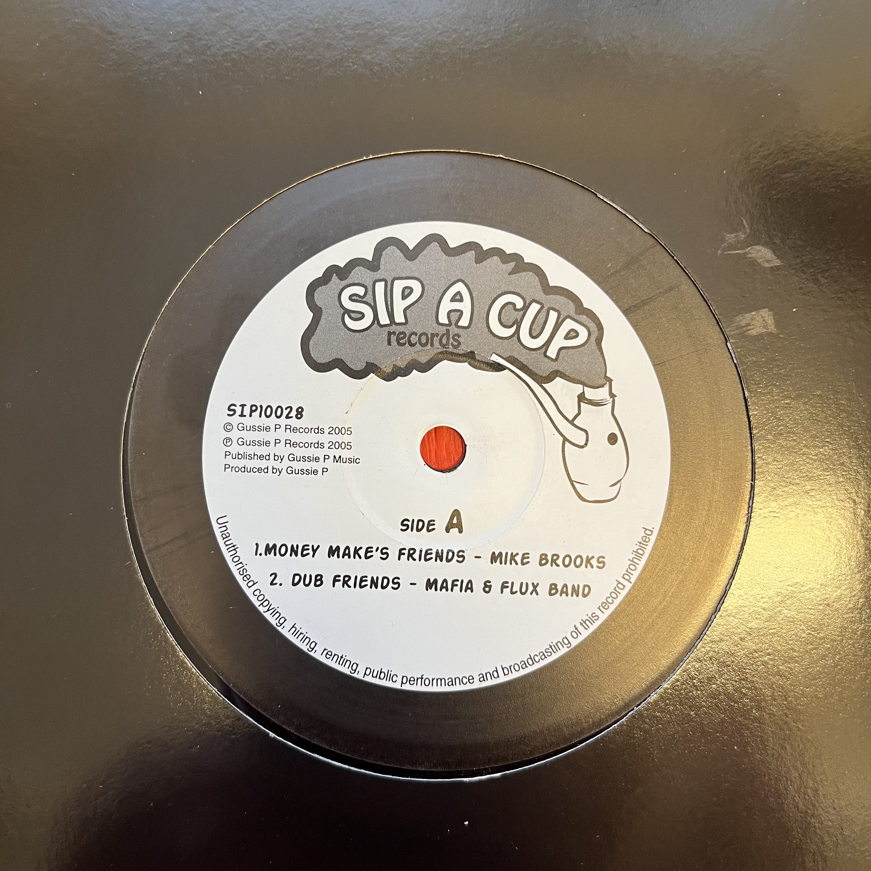 Mike Brooks/Sip-A-Cup Family – Money Make's Friends/Zulu's Attack