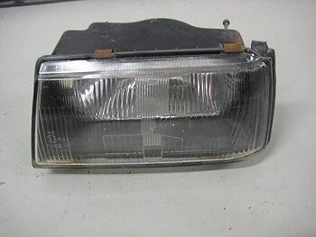 Framlampa Mitsubishi Lancer 84-88 Vänster