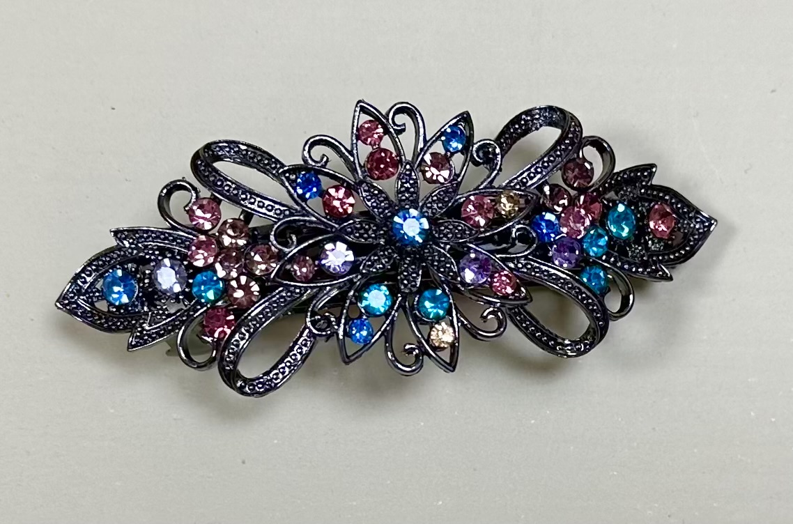 Vacker klämma i strass- multicolor