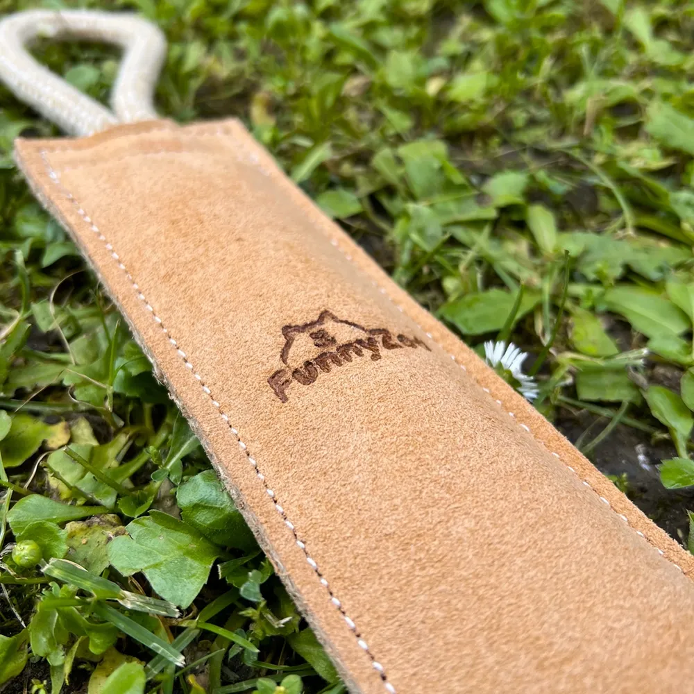 Dog toy leather combat roll with handle