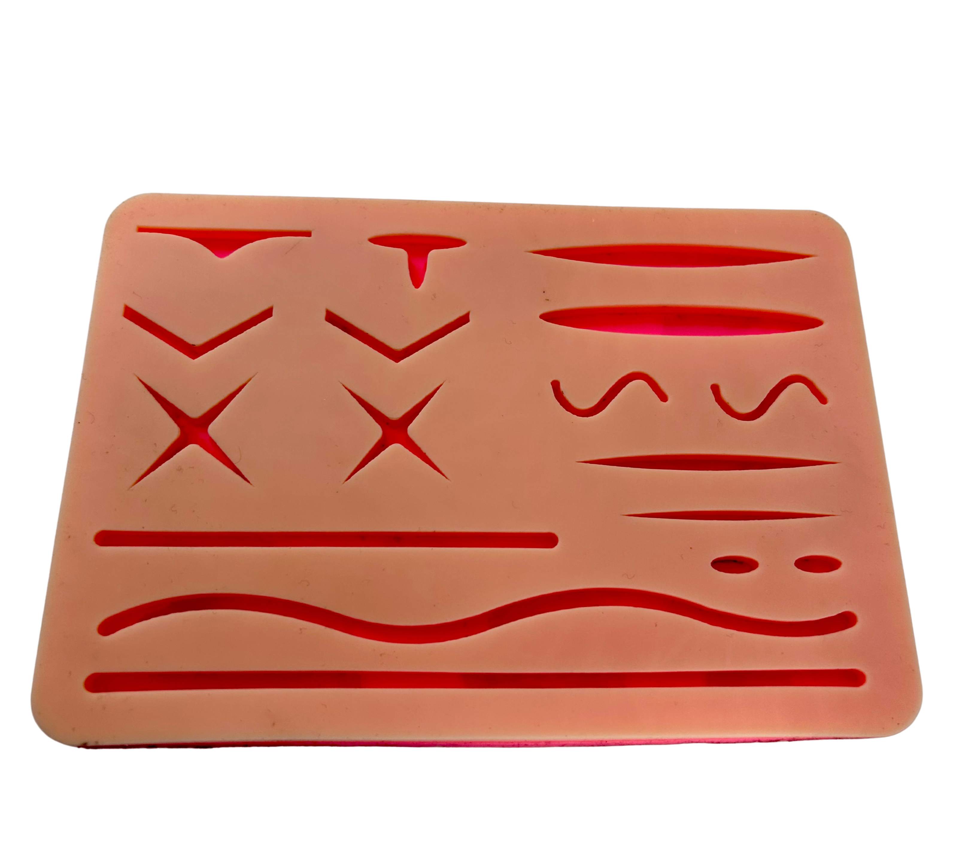 Pad for practicing suturing