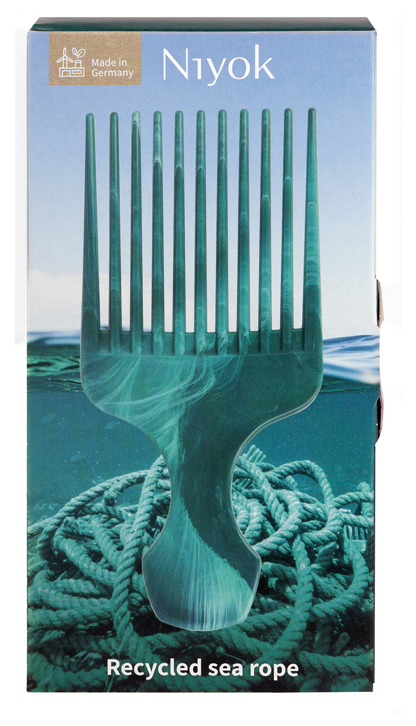 Niyok Afro Comb Recycled Sea Rope i förpackningen som visar att den är gjord av maritim plast