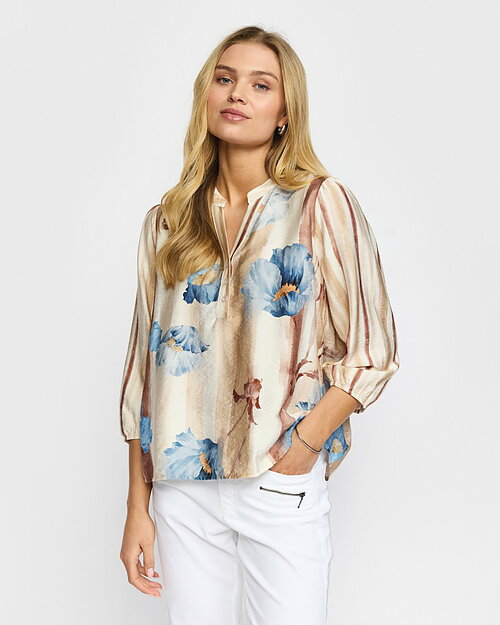 Blus Iris begie med blå blommor