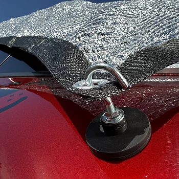 Attach the silver sheet to the car using a magnet with a hook