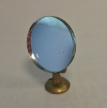 Round mirror with a gold base