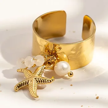 Ring med hängande sjöstjärna och pärla