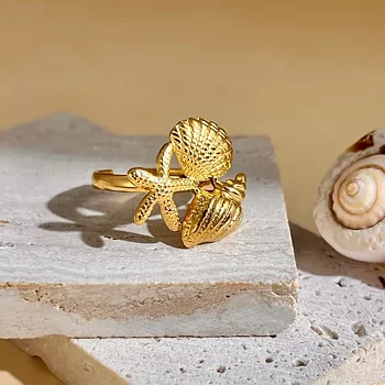 Ring med snäcka och sjöstjärna