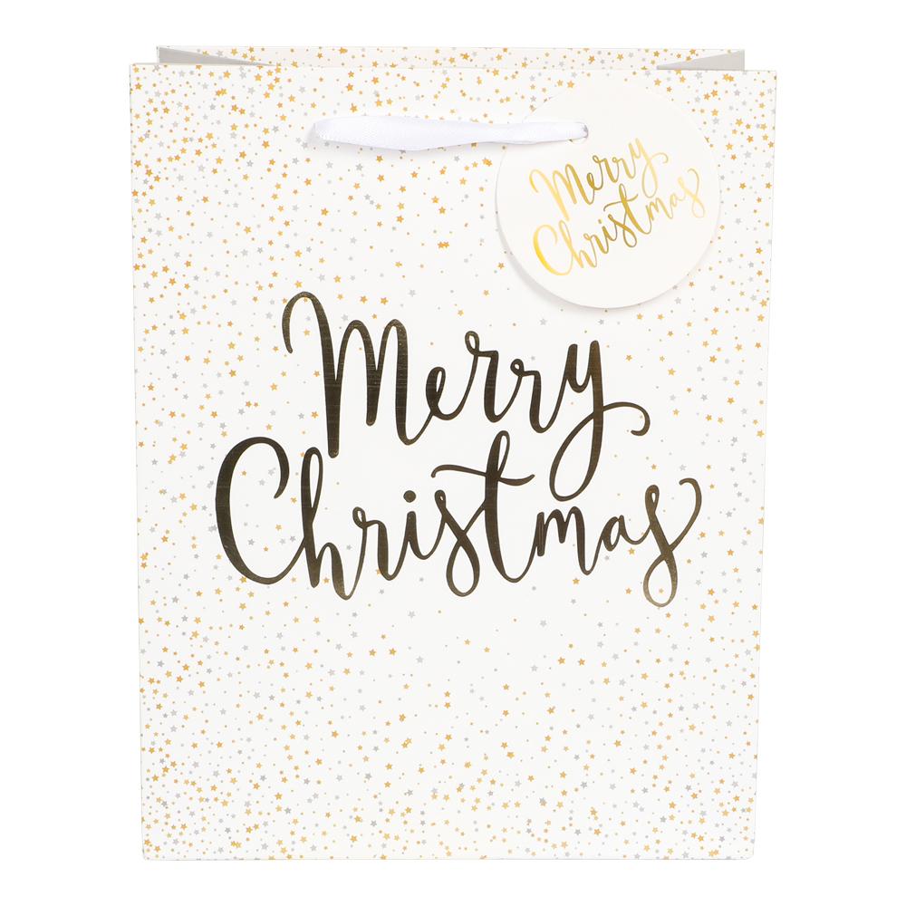 Vit presentpåse Merry Christmas med guldfolie och dekorativa guldstjärnor.