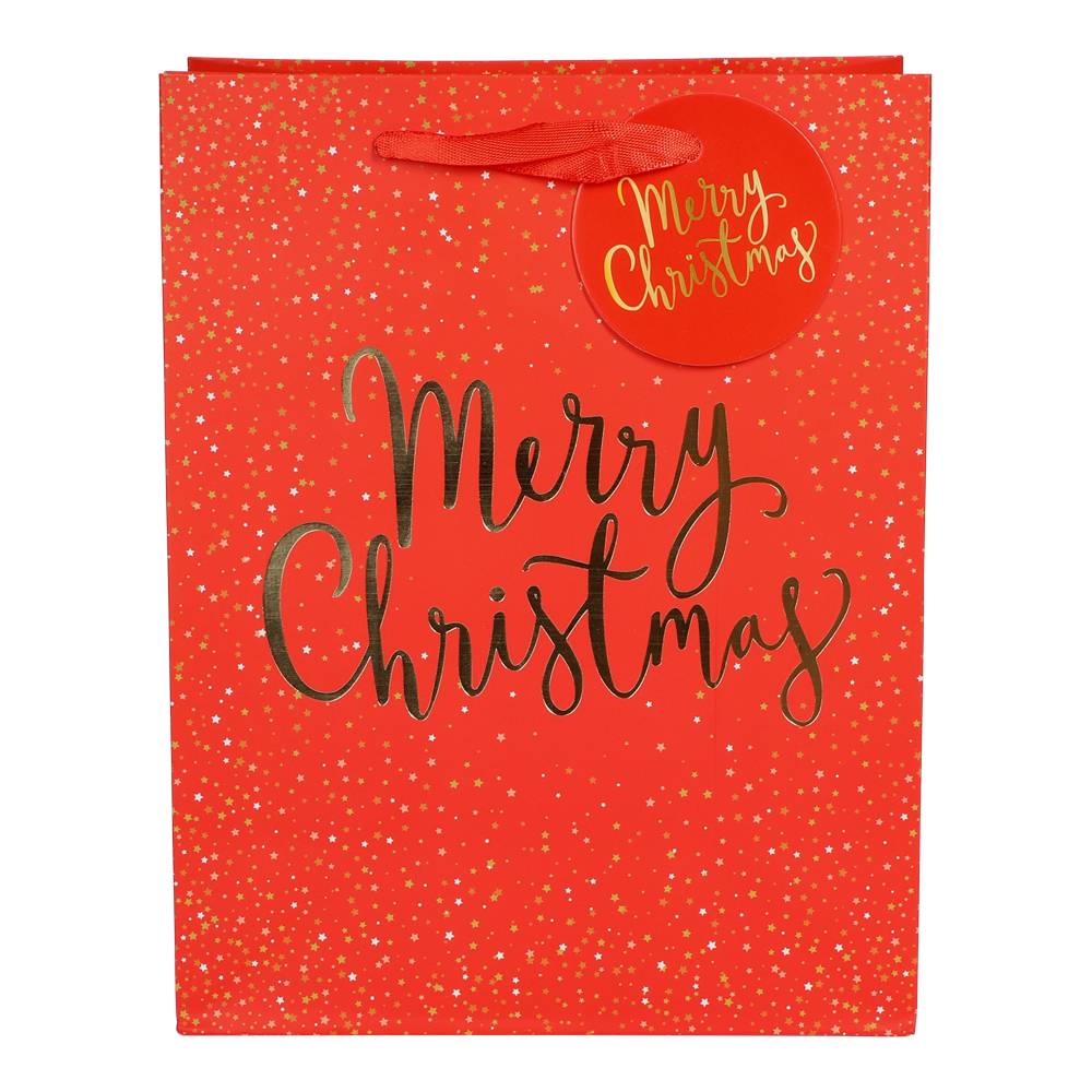 Röd presentpåse Merry Christmas med guldfolie och dekorativa guldstjärnor.