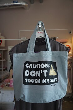 Light blue tote bag CAUTION