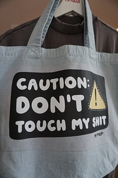 Light blue tote bag CAUTION