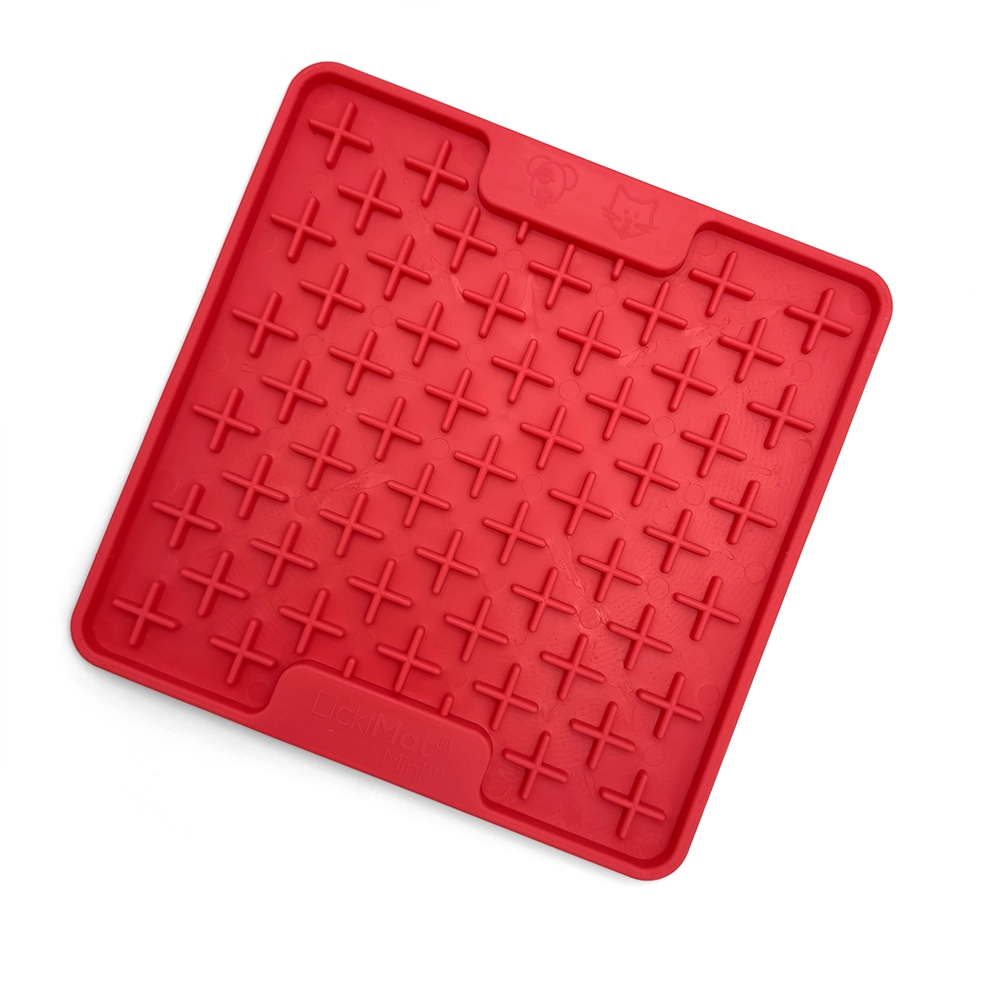 Small licking mat to stimulate a brachycephalic dog with a short snout