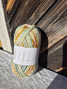 Rebell 9406  Orange/ljus turkos print 100gr Gjestal garn 
