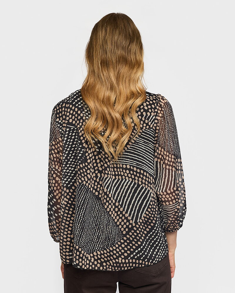 Blus Agnete v-ringning med knyt prickig svart/beige