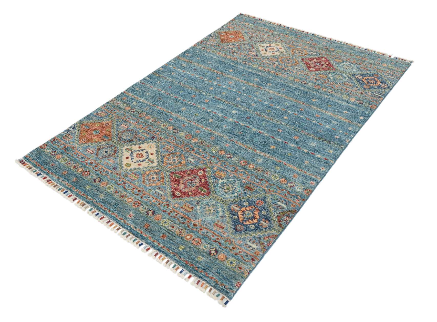 Samarkand Blå 120x182 cm, handknuten afghansk ullmatta fotograferad snett uppifrån med blåmelerad yta och orientaliska motiv.